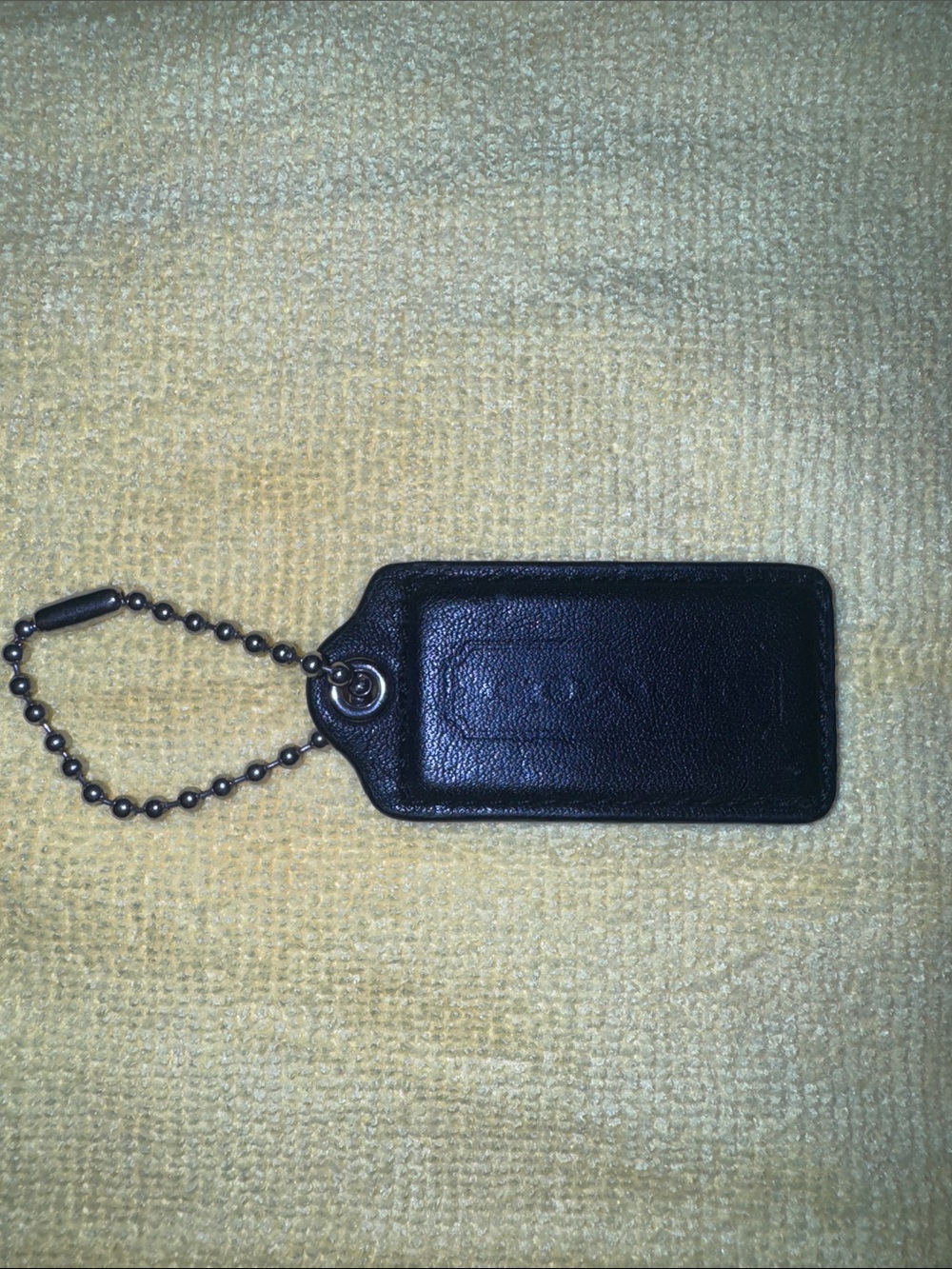 Black Leather Coach hang tag